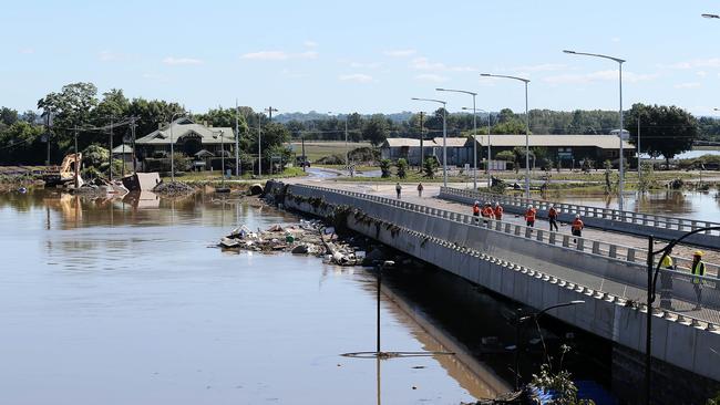 The clean up continues on the Windsor Bridge, which was closed due to the floods. Picture: Tim Hunter