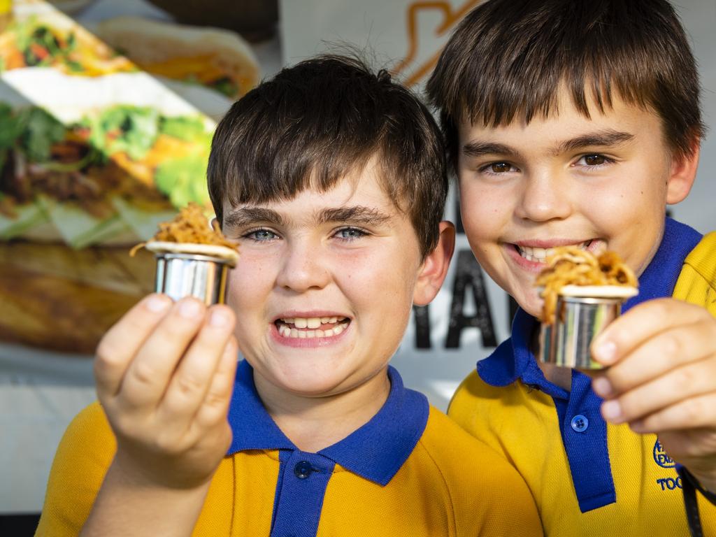 Nicholas (left) and Jaxson May sample Darling Fresh Smoke Haus produce at the Locals 4 Locals summer edition on the lawn of Empire Theatres, Friday, February 18, 2022. Picture: Kevin Farmer