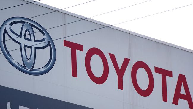 The logo of Toyota Motor is displayed at a car showroom in Tokyo on May 8, 2025. (Photo by Kazuhiro NOGI / AFP)