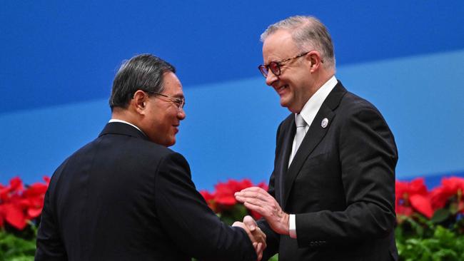 China's Premier Li Qiang, left, and Prime Minister Anthony Albanese shake hands. Picture: AFP