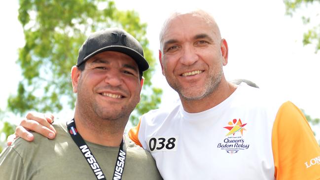 Last Baton Bearer in Townsville Gorden Tallis with Carl Webb - Commonwealth Games 2018 Queens Baton Relay (QBR) - Townsville. Picture: Alix Sweeney