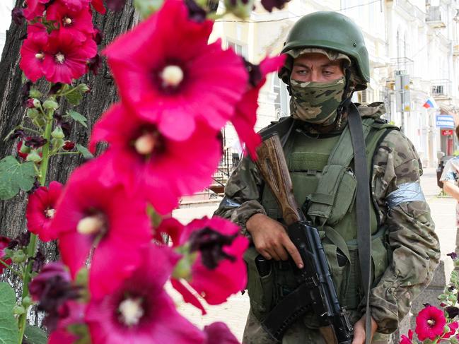 A member of Wagner group stands guard in a street in the city of Rostov-on-Don, on June 24. Picture: STRINGER / AFP