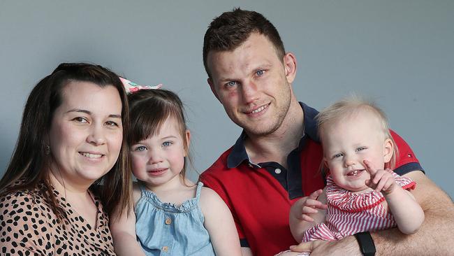 Jeff Horn and his relieved wife Joanna with daughters Isabelle, 2, and Charlotte, 13 months, at home on Thursday. Picture: Annette Dew