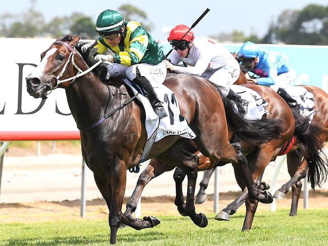 Jockey Jeff Lloyd rides Care To Think to win race 6, the Magic Millions Cup, during the Gold Coast Magic Millions at Aquis Park, Gold Coast Turf Club, Queensland, Saturday, January 13, 2018. (AAP Image/Albert Perez) NO ARCHIVING, EDITORIAL USE ONLY