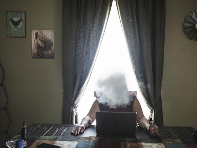 Lorri Cottrill, 45, smokes a e-cigarette in her home in Charleston, West Virginia. She is the leader of the biggest neo-nazi and right wing organization in the US, National Socialist Movement (NSM, in West Virginia. - Generally speaking white people are more intelligent than black people, says Lorri, who is full of extreme opinions. Picture: Espen Rasmussen/World Press Photo