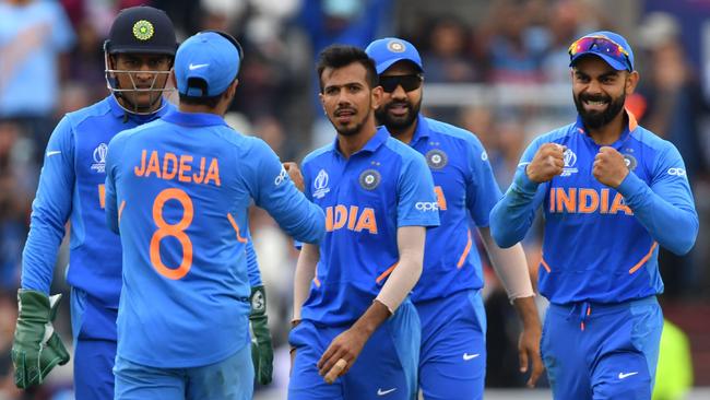 India's Yuzvendra Chahal (C) celebrates with teammates after the dismissal of New Zealand linchpin Kane Williamson. Picture: AFP