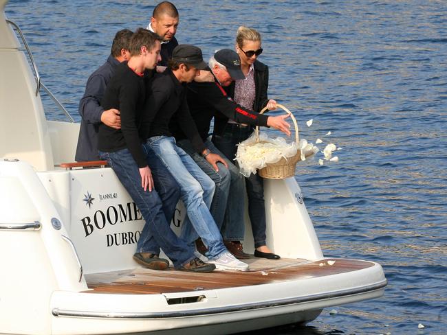 Britt's boyfriend Simon Imberger, brother Darren and father Dale visit the bay where her body was found. File picture