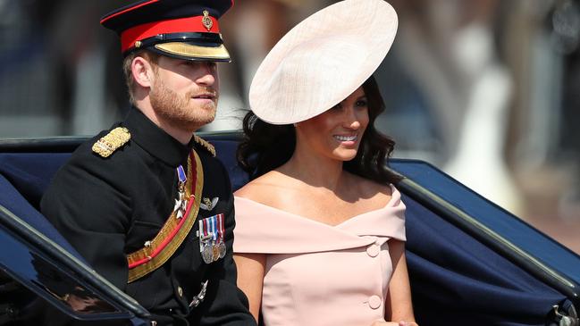 Prince Harry, Duke of Sussex and Meghan, Duchess of Sussex travel in a carriage to Horseguards parade ahead of the Queen's Birthday Parade, 'Trooping the Colour'. Picture: AFP