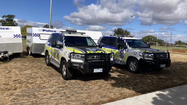 Police cars near where police are searching in the Buninyong region.