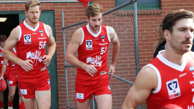 Alex Johnson (centre) runs out for his first game with Northern Blues. Picture: David Crosling.