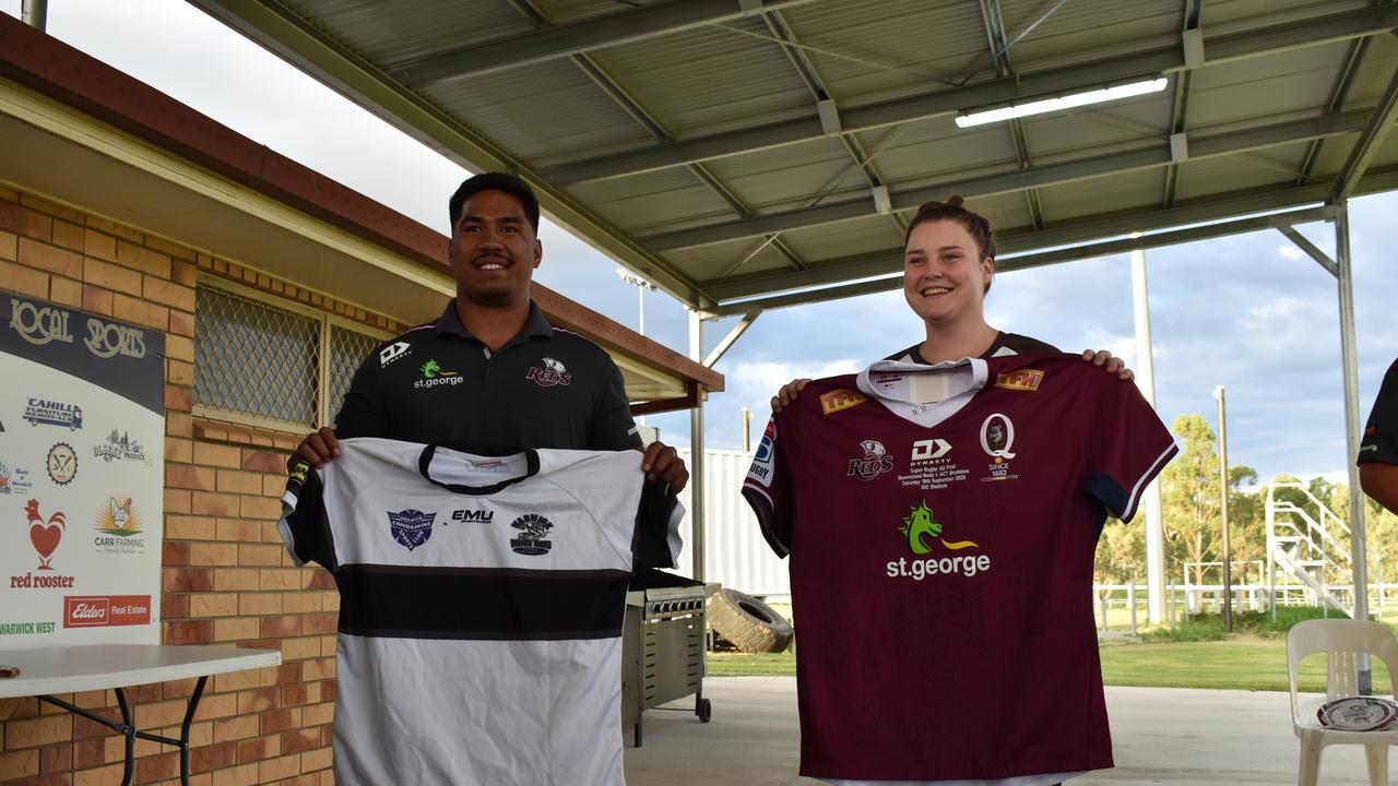 Reds hooker Alex Mafi and Water Rats secretary Tess Enchelmaier after the jersey exchange. Picture: Jessica Paul