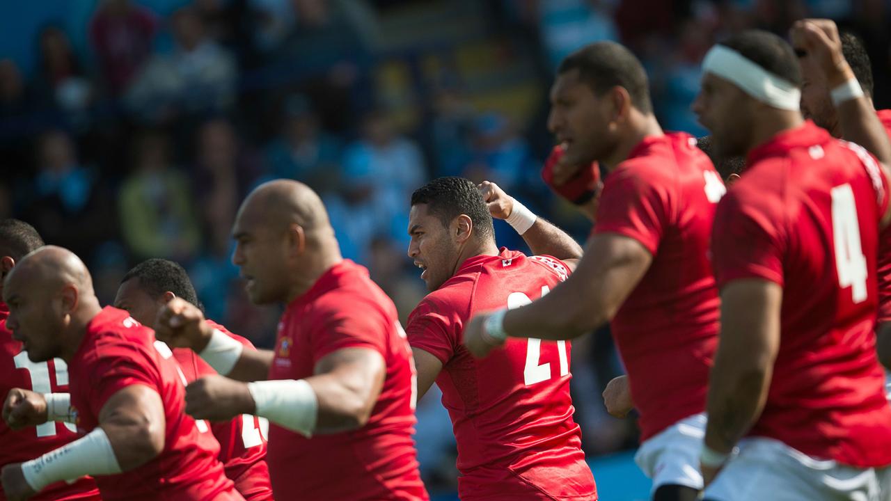 Tonga players perform the Sipi Tau war dance before a Rugby World Cup match.
