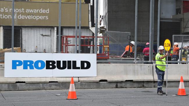 Workers leave the Probuild worksite on 443 Queen St in Brisbane.