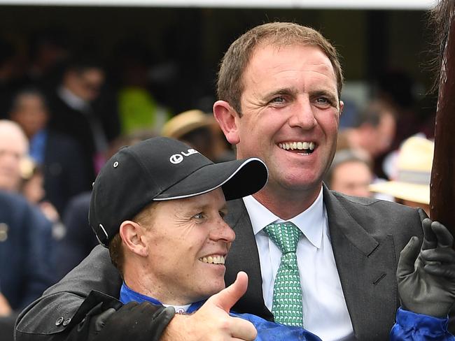 (L-R) Jockey Kerrin McEvoy, trainer Charlie Appleby and strapper Nick Van Eeden are seen after Cross Counter won the Melbourne Cup at Flemington Racecourse in Melbourne, Tuesday, November 6, 2018. (AAP Image/Julian Smith) NO ARCHIVING, EDITORIAL USE ONLY