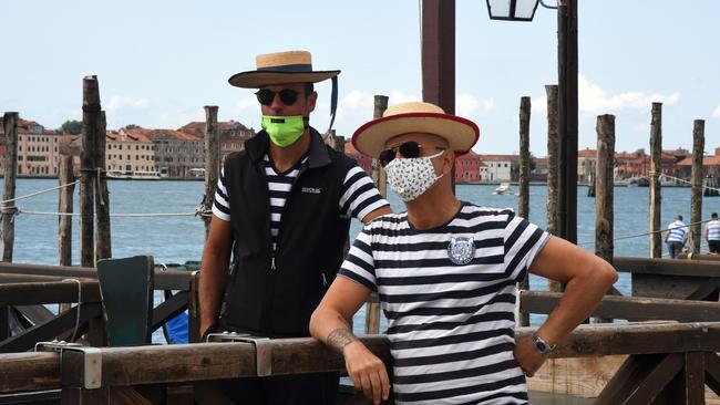 Gondoliers wait for tourists in Venice. Picture: AFP