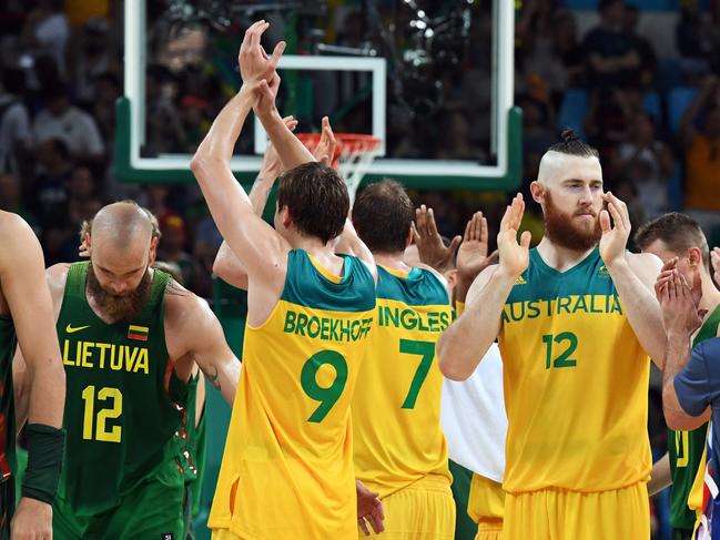 Australia's forward Aron Baynes (R) recats after defeating Lithuania during a Men's quarterfinal basketball match between Australia and Lithuania at the Carioca Arena 1 in Rio de Janeiro on August 17, 2016 during the Rio 2016 Olympic Games. / AFP PHOTO / Mark RALSTON