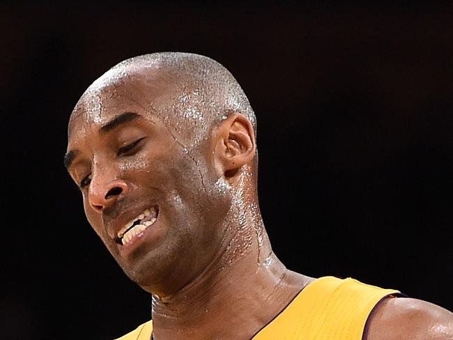 Kobe Bryant (24) of the Los Angeles Lakers reacts during the Lakers NBA match up with the Toronto Raptors, November 20, 2015 at Staples Center in Los Angeles, California. The Raptors defeated the Lakers 102-91. AFP PHOTO / ROBYN BECK