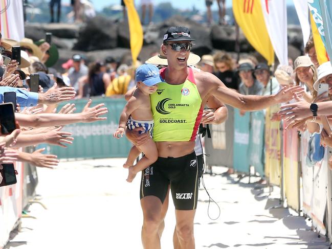 Coolangatta Gold 2021 winner Ali Day in the finishing shoot with son Danny (1). Picture by Richard Gosling