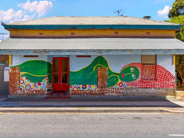 Western suburbs icon with buxom woman mural listed for sale