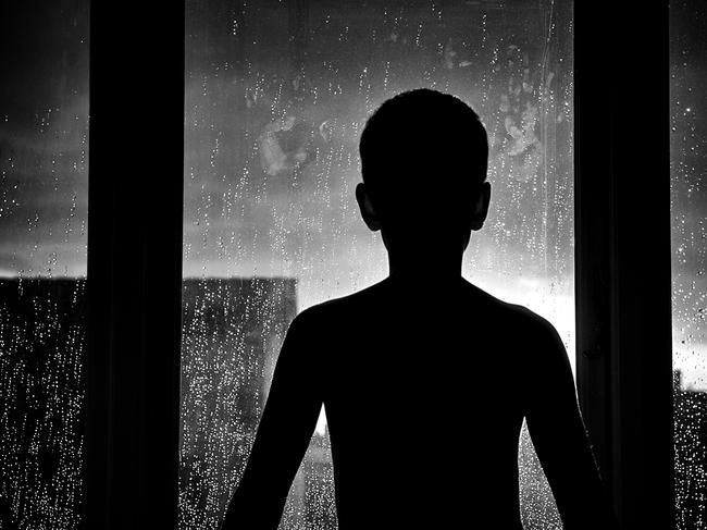 Silhouette of unrecognizable sad child. Generic iStock image.