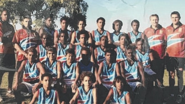 AFL Cape York staff believe this may be the first photo of him playing the sport through their Crusaders program. The photo, with Cameron second from left in the front row, surfaced recently as the Lions surge to the finals.