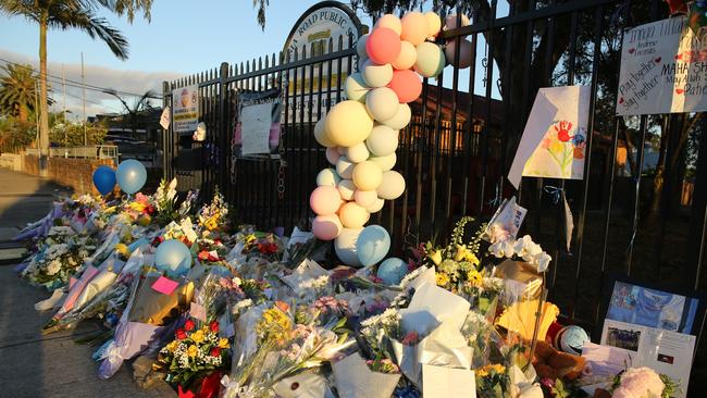 Flowers outside the Banksia Rd Public School following the fatal crash. Picture: John Grainger