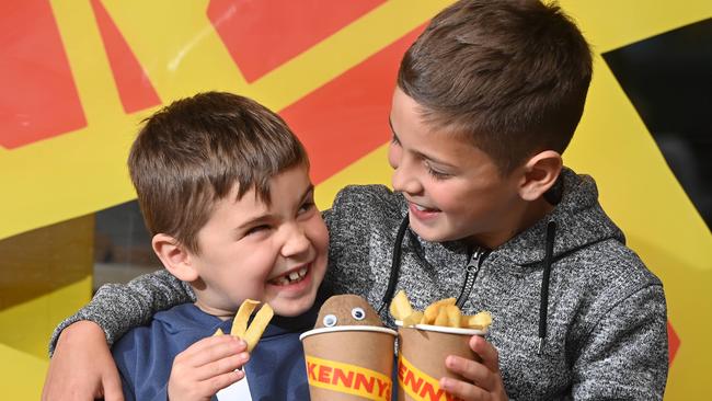 Leon and Kosta are enjoying Kenny’s hot chips. Picture: Keryn Stevens