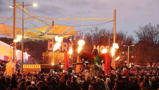 The Swift Parrot Ogoh Ogoh paraded past the entrance to the Dark Mofo Winter Feast on it's journey to Macquarie Point Picture: LUKE BOWDEN