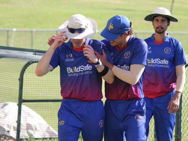 Heat skipper Brodie Symons (left) is congratulated.