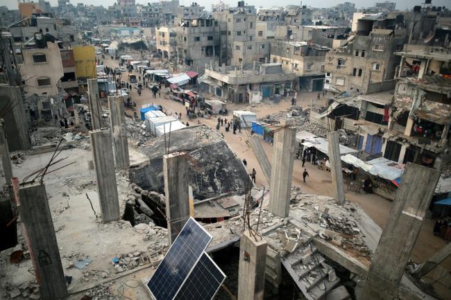 People in southern Gaza celebrate the announcement of a deal to end the 15-month war with Israel