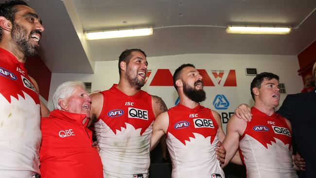 Buddy signs the song after booting nine goals in his 200th game. Picture: Phil Hillyard