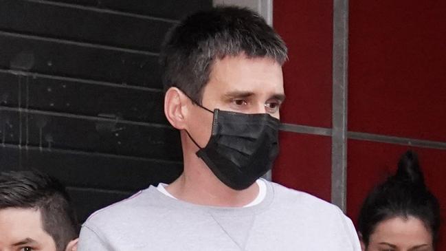 Police lead Richard Pusey from his Fitzroy home.