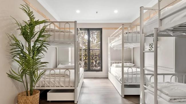 This Darlinghurst rental has six beds in one room.