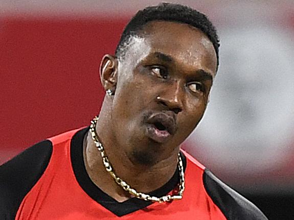 Dwayne Bravo of the Renegades reacts after taking the final wicket during the Big Bash League (BBL) match between the Brisbane Heat and the Melbourne Renegades at the Gabba in Brisbane, Saturday, January 27, 2018. (AAP Image/Dave Hunt) NO ARCHIVING, EDITORIAL USE ONLY, IMAGES TO BE USED FOR NEWS REPORTING PURPOSES ONLY, NO COMMERCIAL USE WHATSOEVER, NO USE IN BOOKS WITHOUT PRIOR WRITTEN CONSENT FROM AAP