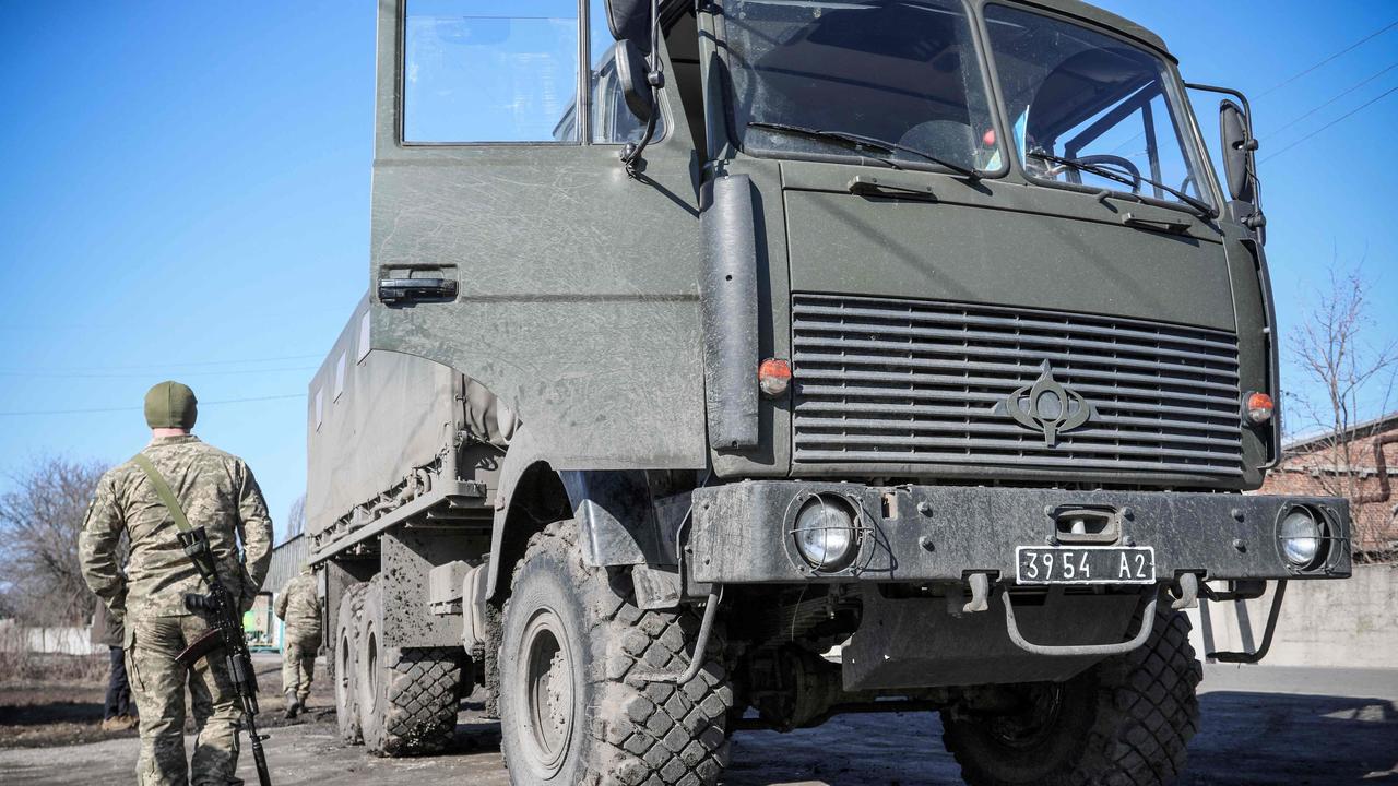 A Ukrainian Military Forces serviceman walks past a military vehicle in the Donetsk region town of Avdiivka. Picture: Aleksey Filippov/AFP