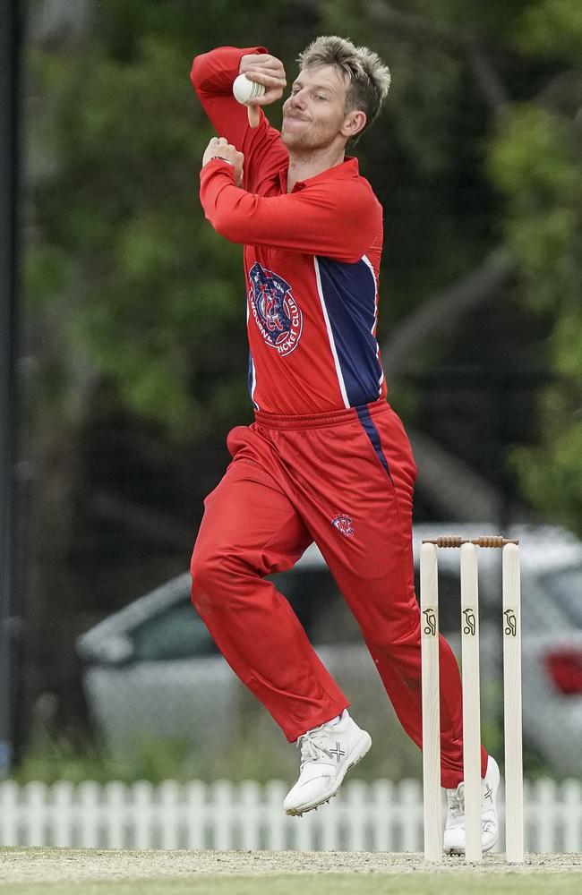 Jack Craig sends down an offie against Dandenong. Picture: Valeriu Campan