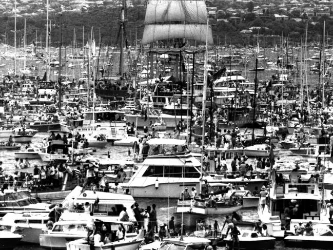 Historic picture from January 26, 1988 when spectator craft near the Opera House crowded around tall ship "Our Svanen" on Sydney Harbour, as part of the First Fleet re-enactment for Bicentennial.