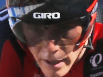 BMC racing team members Daniel Oss, right, congratulates teammate Rohan Dennis, center, after winning the Men's Team Time Trials for the UCI Road World Championships in Richmond, Va., Sunday, Sept. 20, 2015. BMC won the race by 11.35 seconds. (AP Photo/Steve Helber)