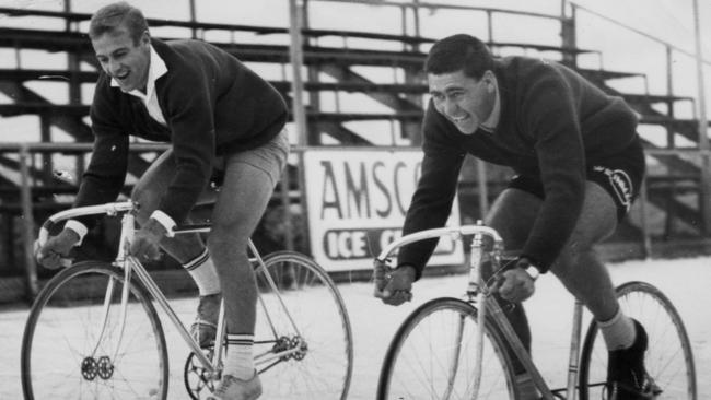 Central District footballer Gary Window with Sturt legend Bob Shearman cycling at the Norwood velodrome in 1965.