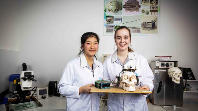 Emma Nguyen and Tara Stewardson from Ivanhoe Girls’ Grammar School, in the Bionics Institute’s laboratory. Picture: Nicole Cleary