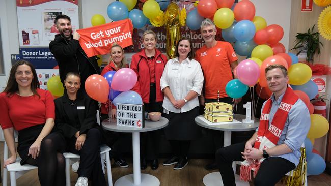 Former Sydney Swans player Brett Kirk with Lifeblood staff at the donor centre at Swans HQ in Moore Park.