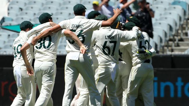 Australia's players celebrate the final wicket of England's batsman James Anderson to win the third Test and the MCG and retain the Ashes. Picture: AFP