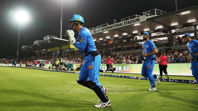 Alex Carey leads the Strikers onto the field during the Big Bash League (BBL) cricket match between the Sydney Sixers and Adelaide Strikers at Coffs International Stadium in Coffs Harbour, Sunday, January 5, 2020. (AAP Image/Jason O'Brien)