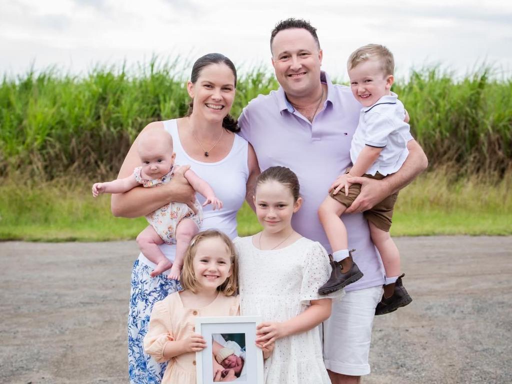 The van der Giessen family with a photo of Jack.