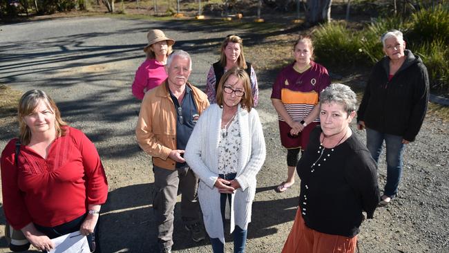 Residents Diane Conaghan, Rebekah Cicero, Michelle Parsons, Erwin Hecht, Karen Evans-Ashdown, Stella de Bruin, Amanda Pisani and Belinda Young are opposed to the new Burpengary Community Club development. Photo: Luke Simmonds.