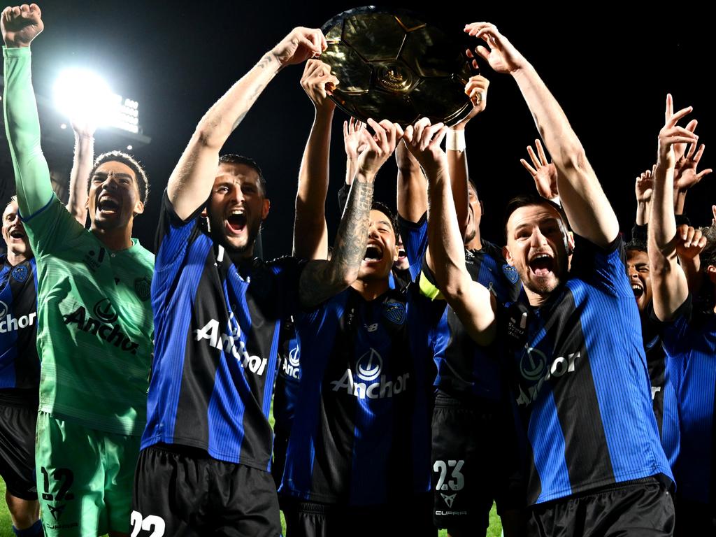 Auckland FC players celebrate after winning the A-League premiership. Picture: Hannah Peters/Getty Images