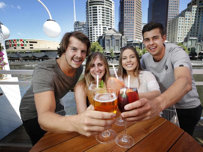 Australians will have to slash their alcohol consumption by four drinks per week to fit within stringent new guidelines issued by the nationÕs peak medical body today. Previously the safe drinking guidelines allowed up to 14 drinks per week that will be lowered to just 10 drinks under the proposed new guidelines. Enjoying a drink by the Yarra River at the Arbory Bar are David Fehringer 27 Melbourne, Steph Gozdawa 32 Melbourne, Sarah Marshall 25 Toorak and Ben Davies 26 Altona.       Picture: David Caird