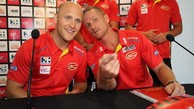 Gold Coast’s inaugural captain Gary Ablett and coach Guy McKenna.