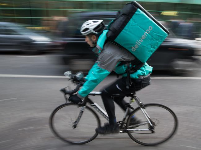 Food Delivery company 'Deliveroo' in Camden Town, north London. Employees are keeping their distance from customers. Picture: AFP