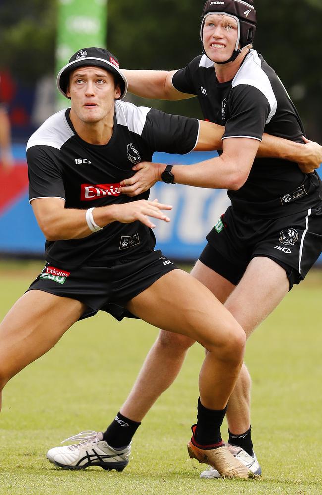 Sam McLarty battling it out with Darcy Moore at Collingwood training.